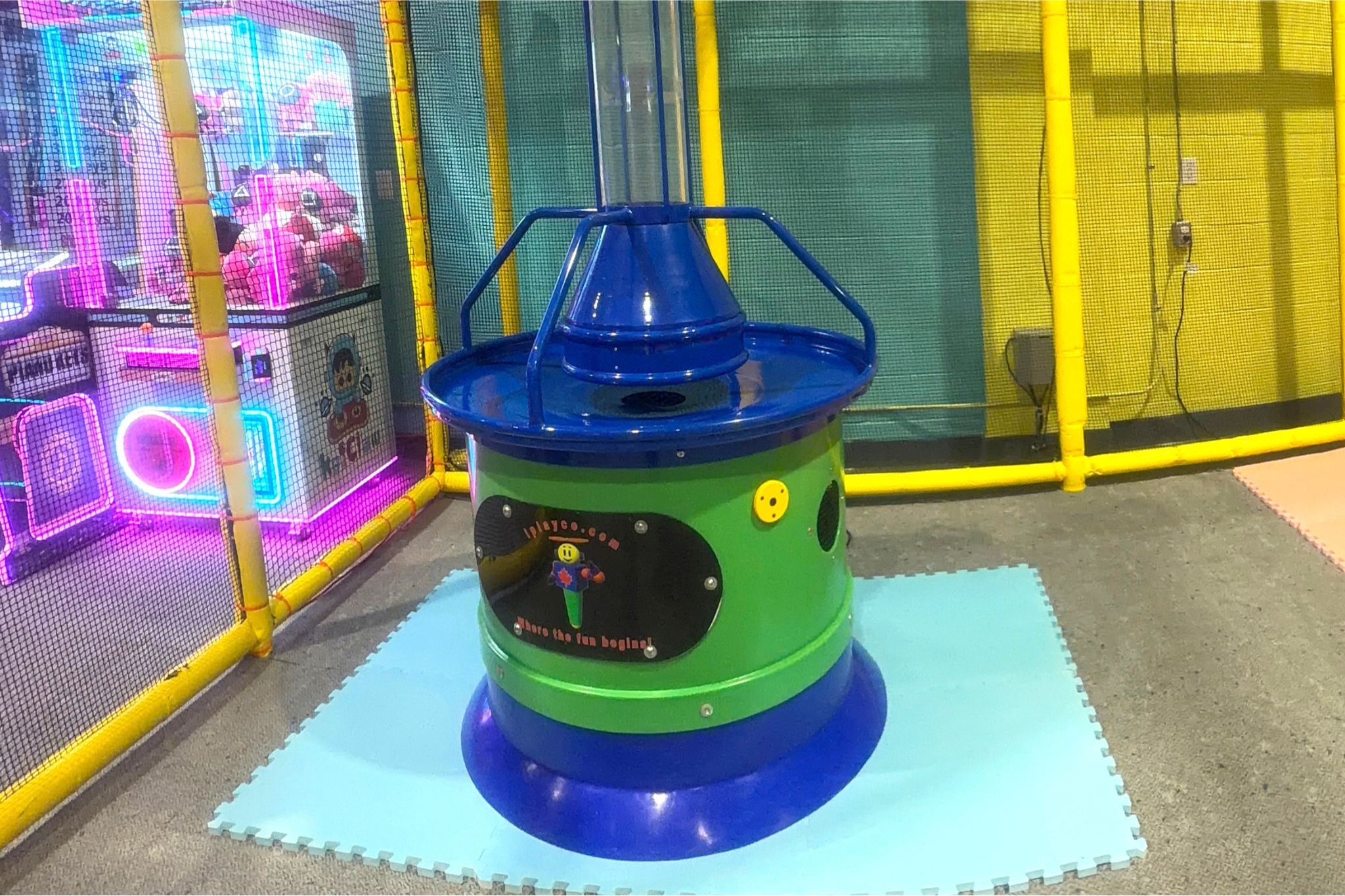 Colorful ball vacuum machine in the indoor play area.