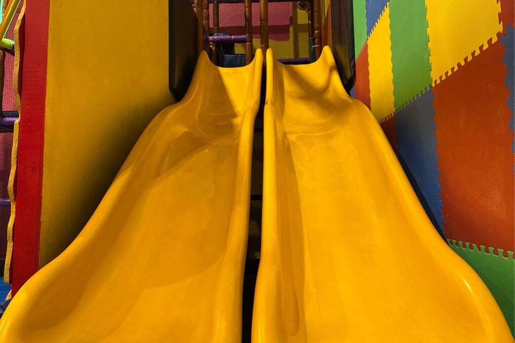 Close-up View of Yellow Indoor Speed Slides