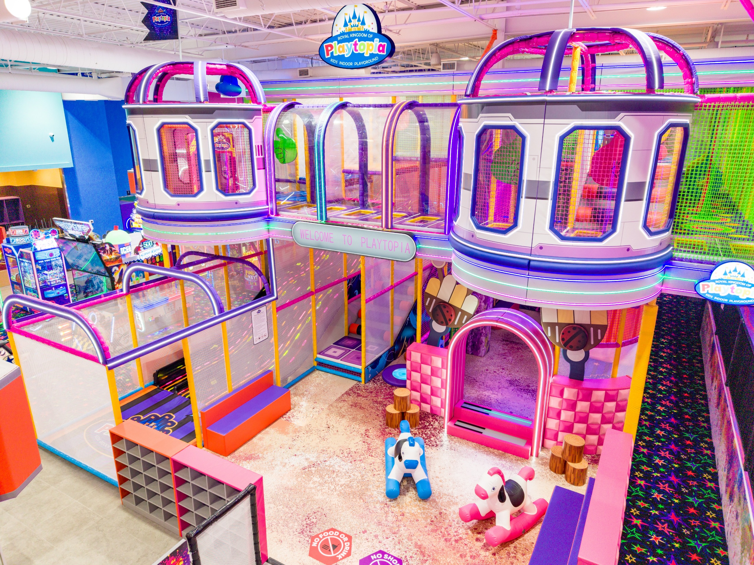 Multi-level jungle gym with play tunnels and soft mats.