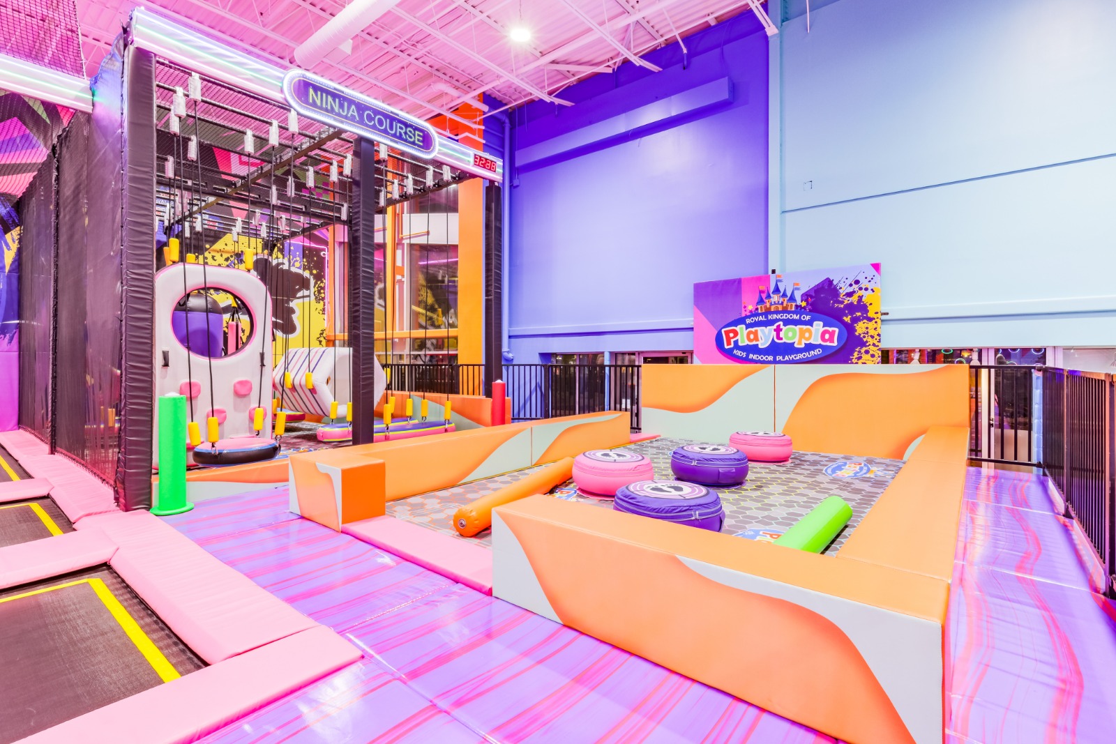 Balance beam challenge with colourful foam safety pads.