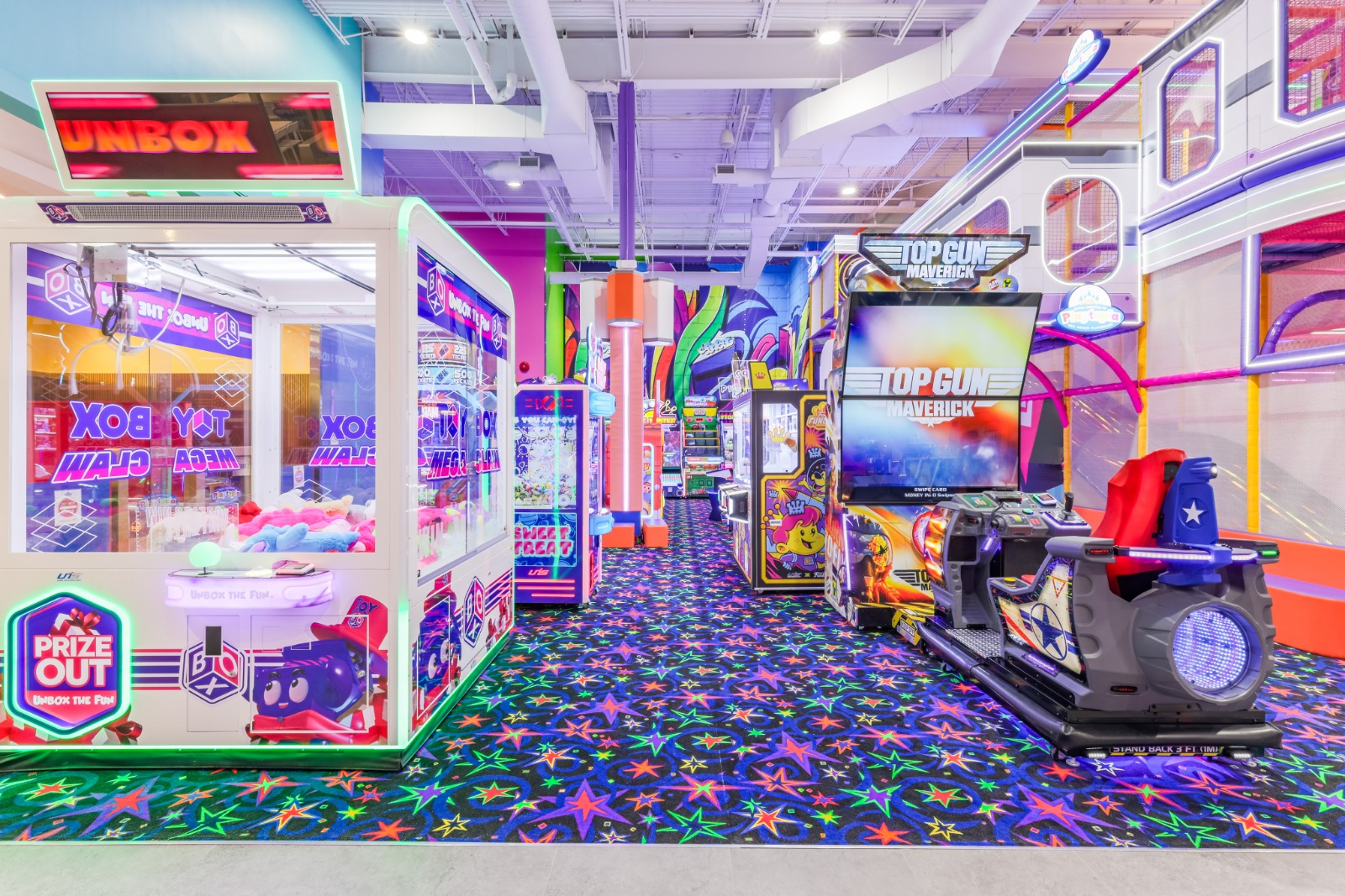Brightly lit indoor arcade with prize-winning games.