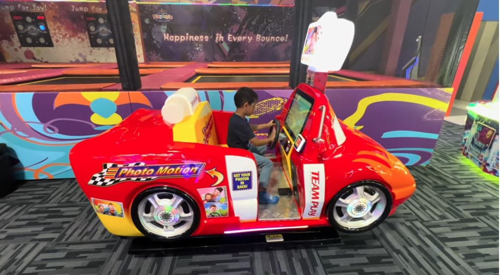 Glowing arcade machines and gaming consoles for kids.