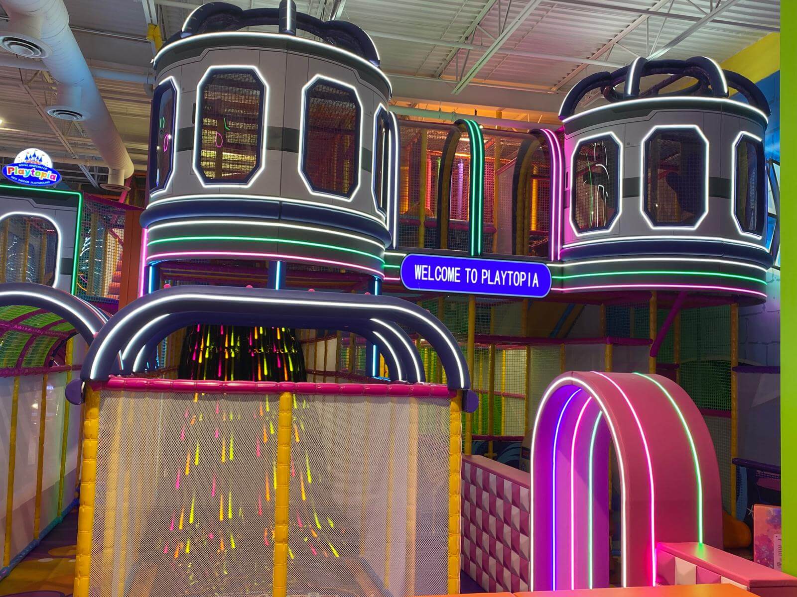 Futuristic spaceships themed pods and multi-level indoor playground structures at Playtopia Burlington.