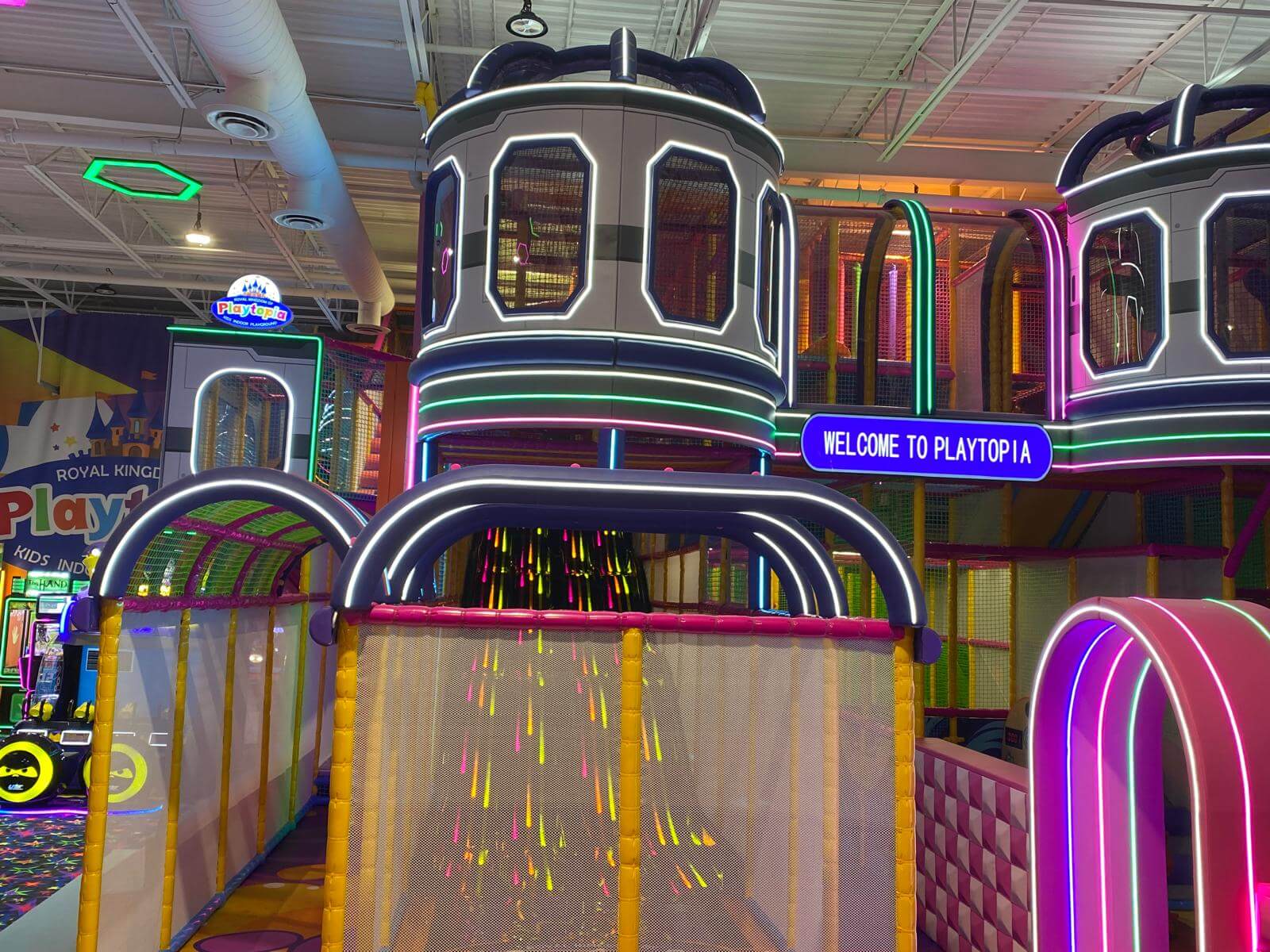 Futuristic spaceships themed pods and multi-level indoor playground structures at Playtopia Burlington.